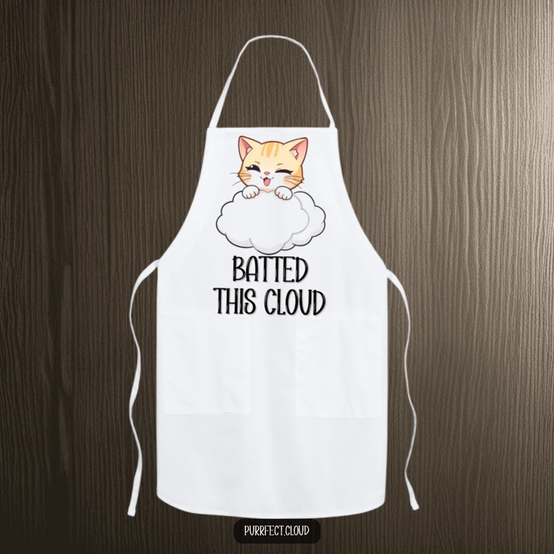 Funny cat apron depicting a mischievous cat about to pounce on a whimsical, floating cloud.