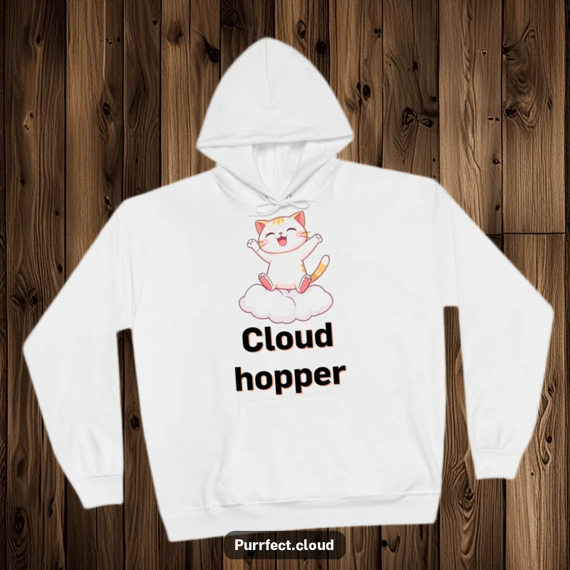 Funny Cat Hoodie, a happy cat leaping between clouds, perfect for cozying up after an adventure, offering comfort and whimsical fun.