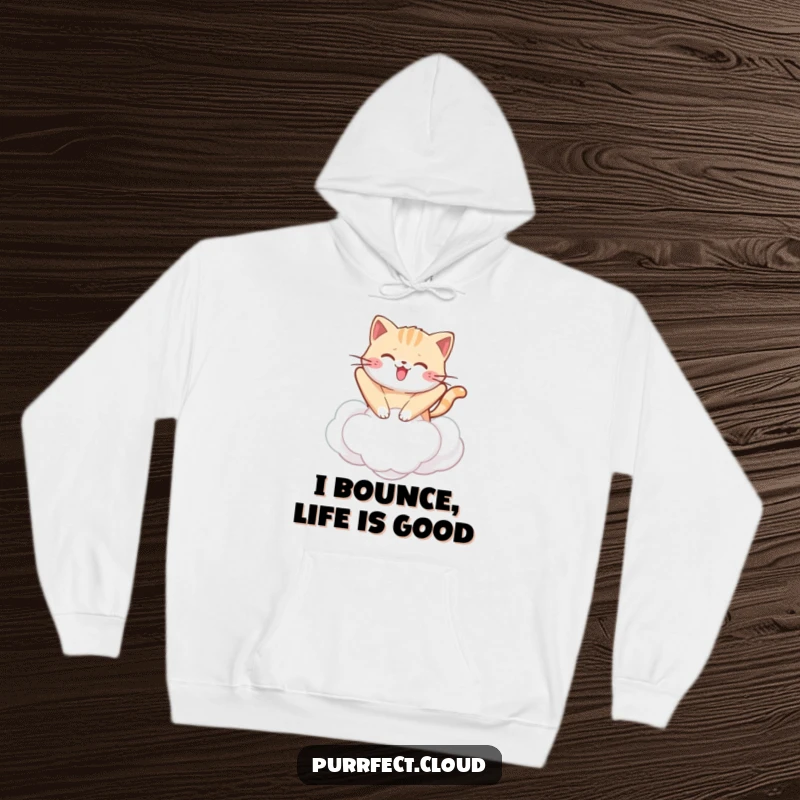 Funny kawaii cat hoodie showing a cute cat happily bouncing on a cloud, providing warmth and adorable humor.