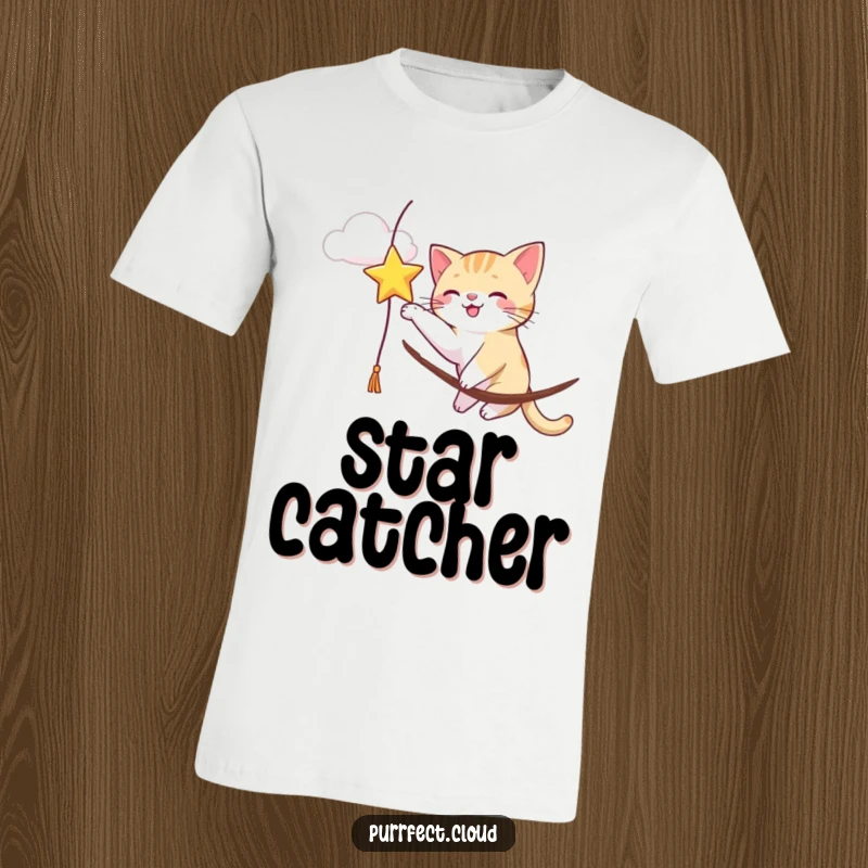Funny, energetic cat batting at a shimmering star hanging from a cloud, a playful and humorous graphic tee.