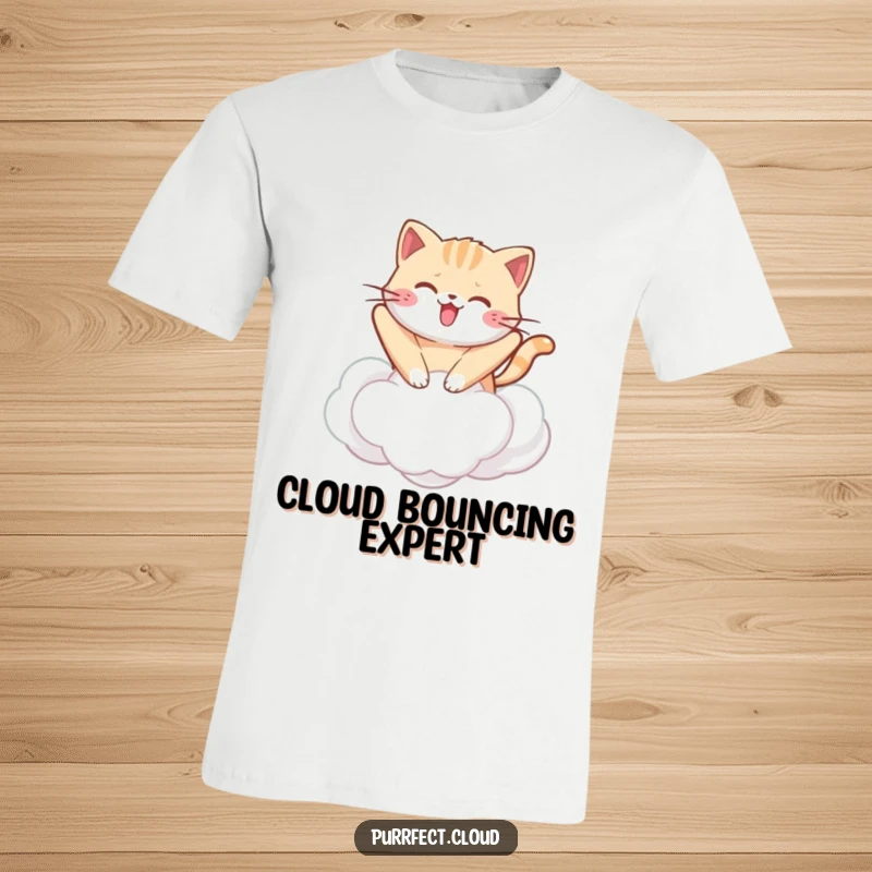 Funny kawaii cat t-shirt featuring a cute cat joyfully bouncing on a soft cloud, perfect for lovers of cuteness.