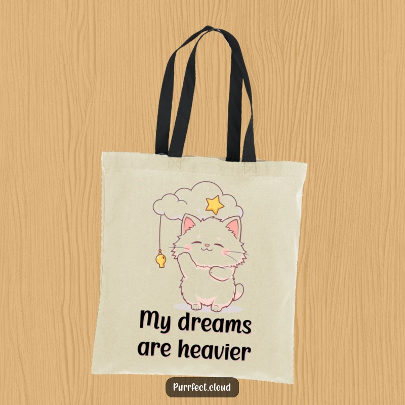 Funny fluffy cat character batting at a star from a cloud, this tote bag is perfect for carrying daily essentials with joy.